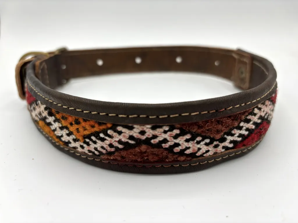 Desert Dunes collar at an angle showing the stepped zigzag weave and stitched leather edge